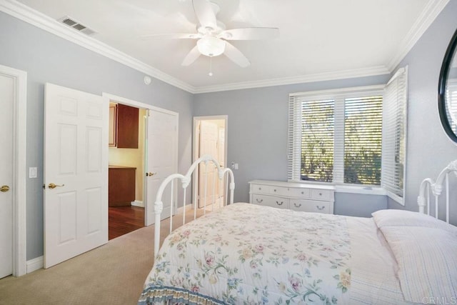 bedroom featuring visible vents, baseboards, ceiling fan, and ornamental molding