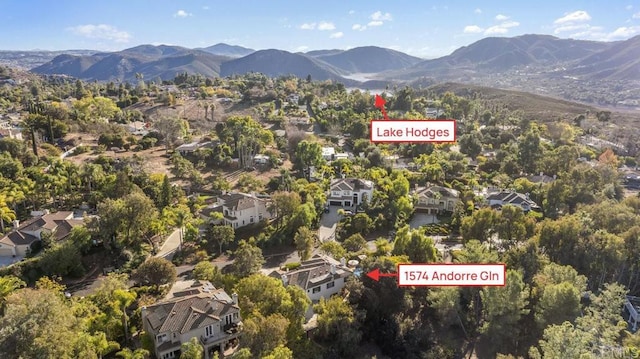 birds eye view of property with a mountain view