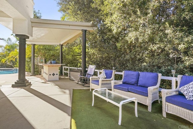 view of patio / terrace with an outdoor living space and an outdoor pool