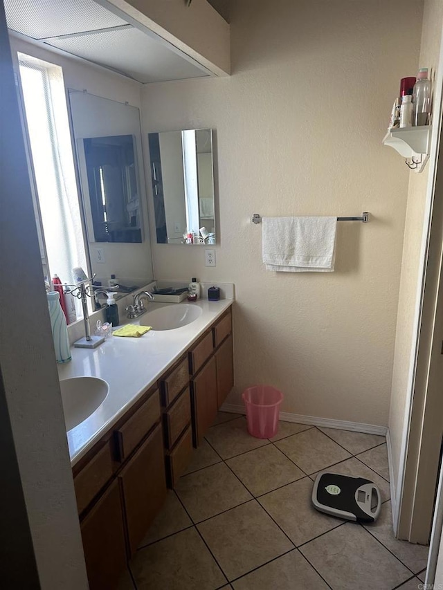 bathroom featuring tile patterned flooring and vanity