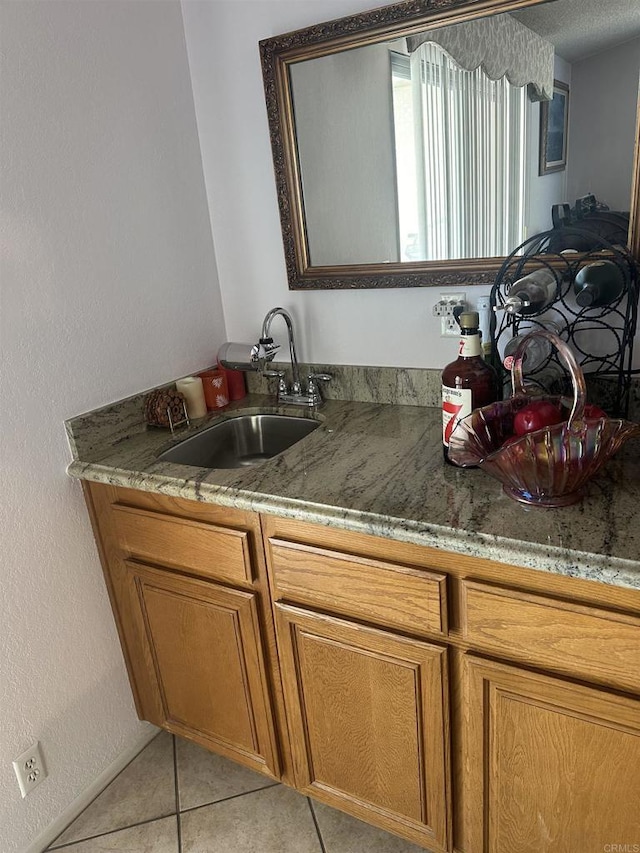 kitchen with sink and light tile patterned flooring