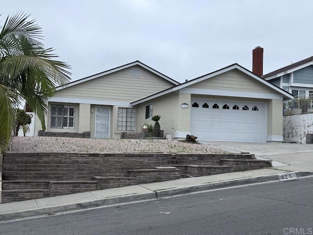 124 Palawan Way, San Diego, CA 92114 - view of front facade featuring concrete driveway, stucco siding, and a garage