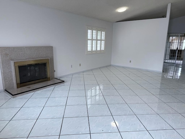 124 Palawan Way, San Diego, CA 92114 - unfurnished living room featuring light tile patterned flooring, a glass covered fireplace, and baseboards