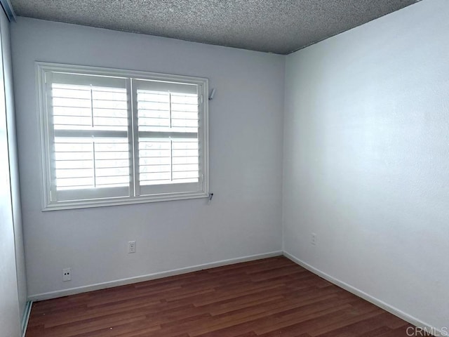 124 Palawan Way, San Diego, CA 92114 - spare room with healthy amount of natural light, wood finished floors, a textured ceiling, and baseboards