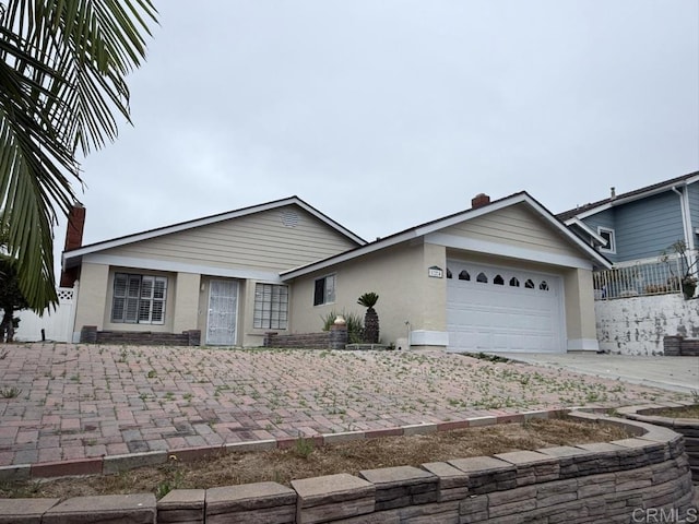 124 Palawan Way, San Diego, CA 92114 - ranch-style home featuring a garage, a chimney, stucco siding, and concrete driveway
