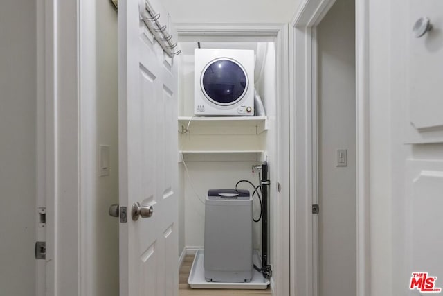 laundry area featuring hardwood / wood-style floors