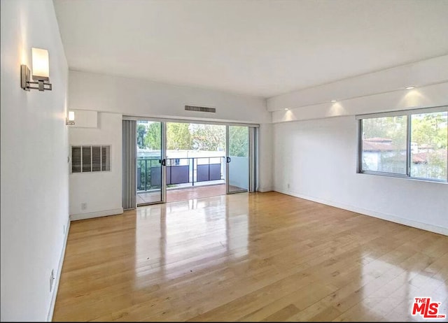 unfurnished living room featuring light hardwood / wood-style flooring