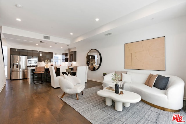 living room featuring dark hardwood / wood-style floors