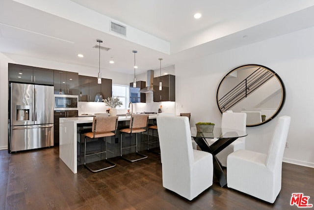 dining room with dark hardwood / wood-style flooring and sink