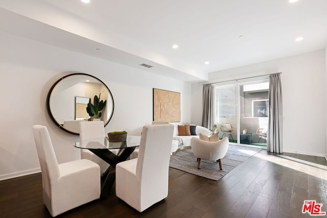 dining space with dark wood-type flooring