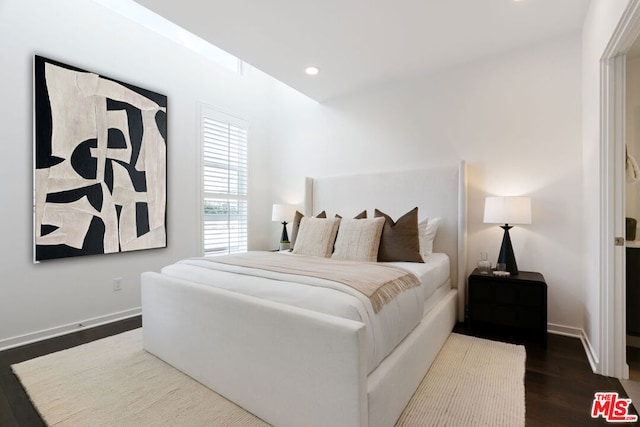 bedroom featuring hardwood / wood-style floors