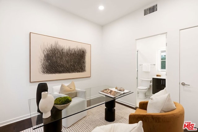 sitting room with hardwood / wood-style flooring