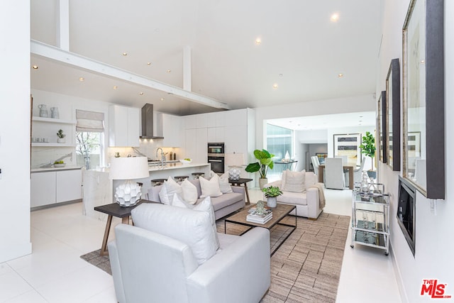 living room with sink and light tile patterned flooring