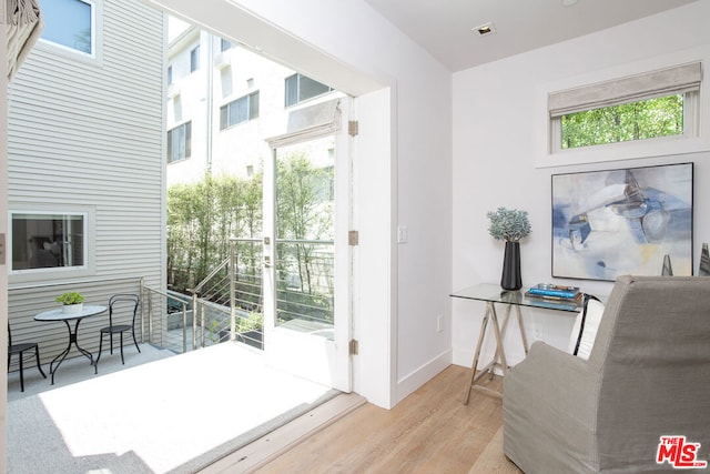 doorway to outside with light hardwood / wood-style flooring