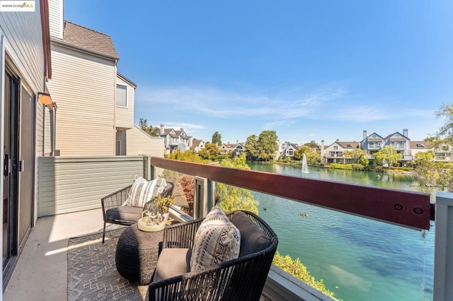 balcony featuring a water view