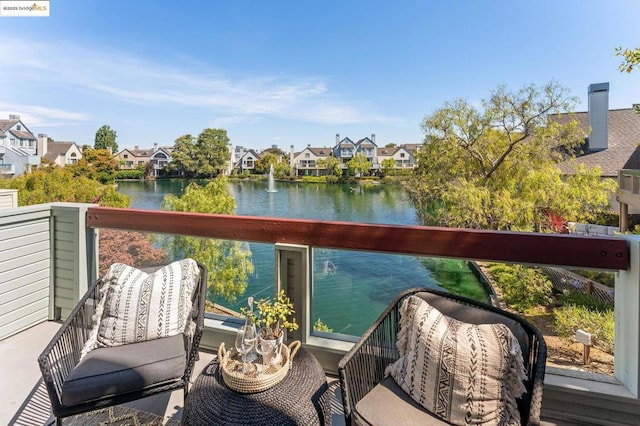 balcony featuring a water view