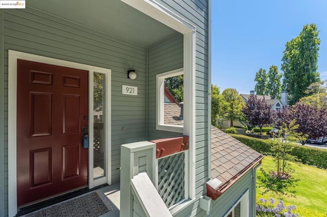 view of exterior entry featuring a porch