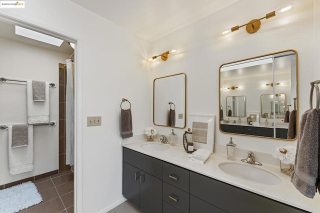 bathroom with vanity and tile patterned floors