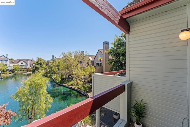 balcony featuring a water view