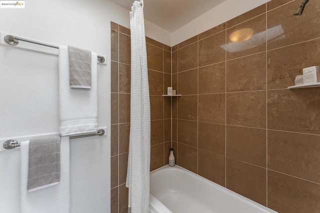 bathroom featuring shower / tub combo with curtain