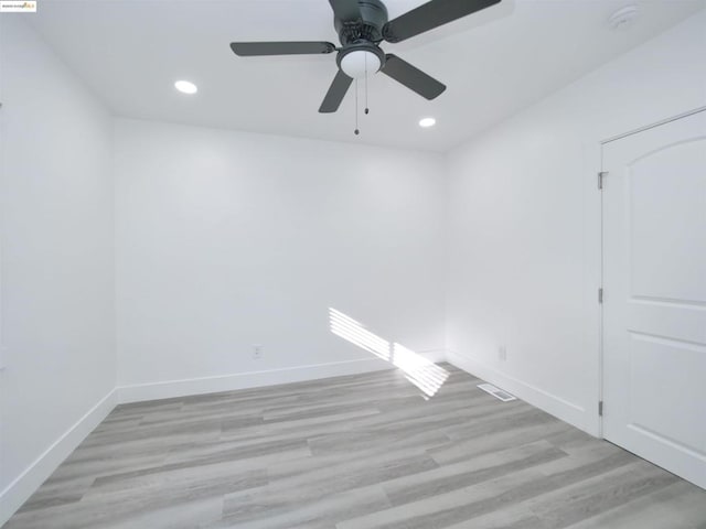 unfurnished room featuring ceiling fan and light hardwood / wood-style flooring