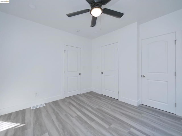 unfurnished bedroom featuring light hardwood / wood-style floors and ceiling fan