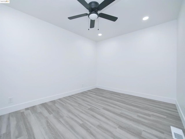 unfurnished room with light hardwood / wood-style flooring and ceiling fan