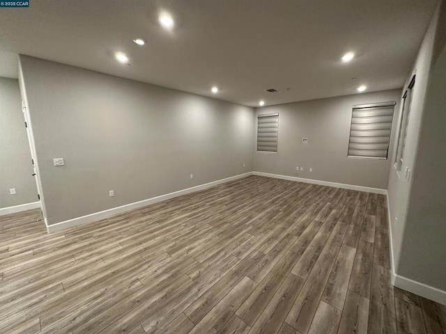 spare room with hardwood / wood-style floors