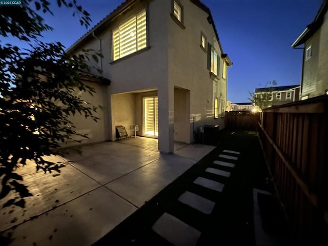 rear view of property featuring a patio