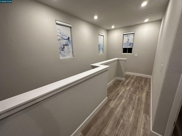 corridor featuring hardwood / wood-style floors