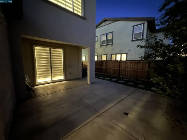 view of patio at twilight