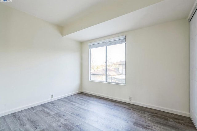 spare room featuring hardwood / wood-style floors