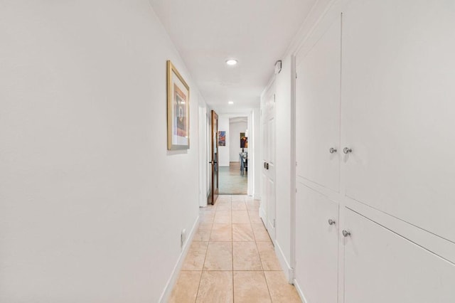 corridor with light tile patterned floors