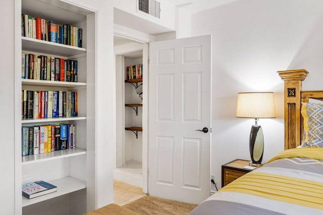 bedroom with light colored carpet