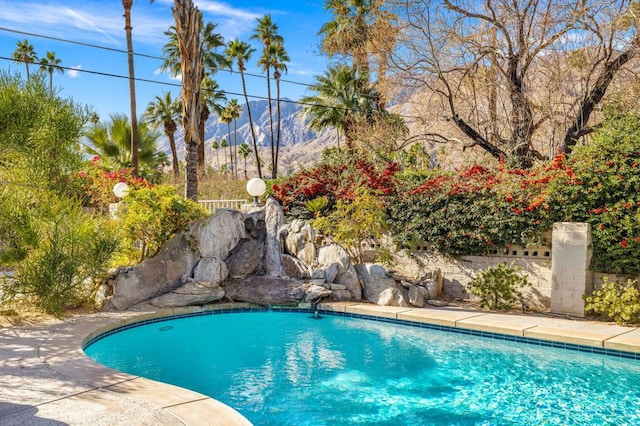 view of pool with a mountain view