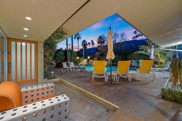 view of patio terrace at dusk