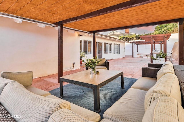 patio terrace at dusk featuring outdoor lounge area and a pergola