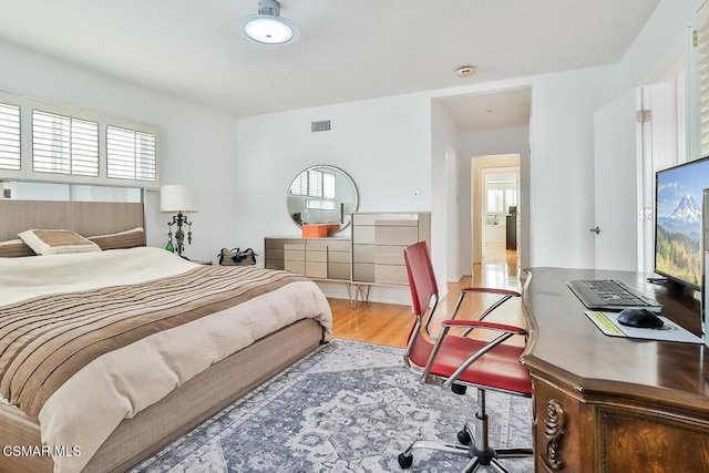 bedroom with wood-type flooring