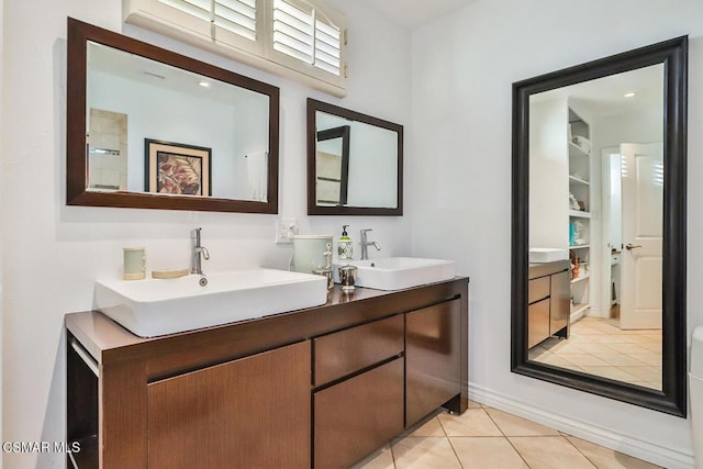 bathroom featuring tile patterned flooring and vanity