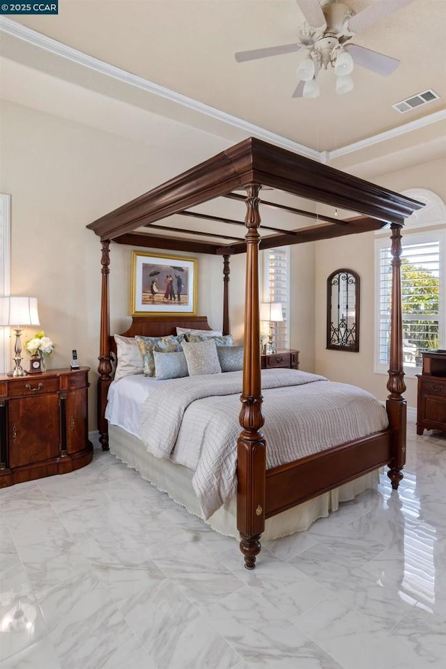 bedroom with ceiling fan and crown molding