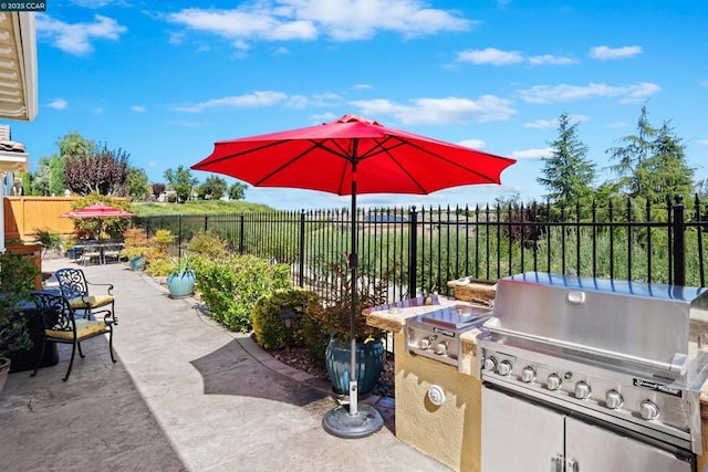 view of patio / terrace with a grill