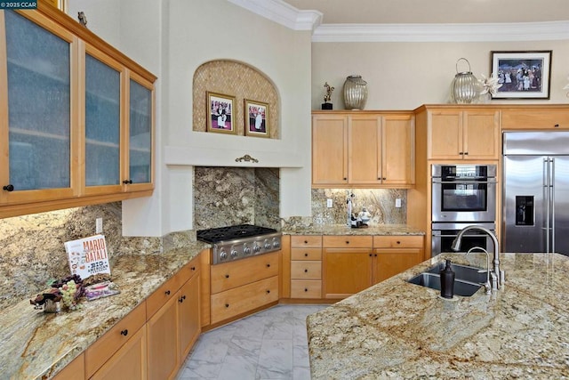 kitchen featuring tasteful backsplash, light stone counters, sink, and stainless steel appliances