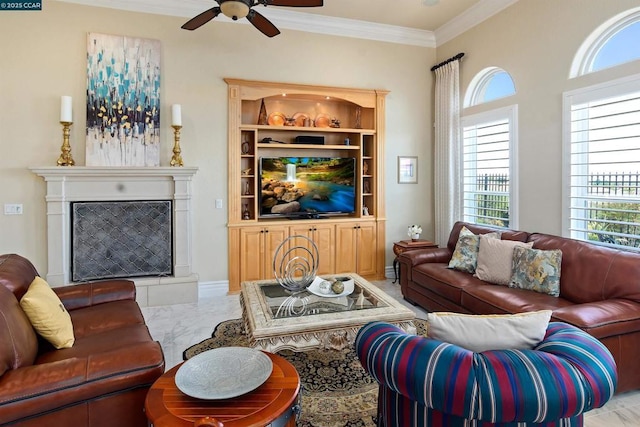 living room with ceiling fan and crown molding