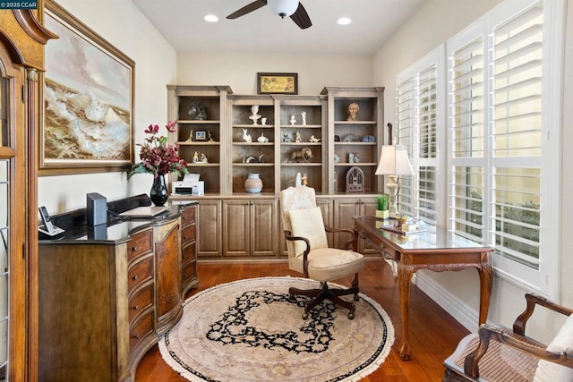 living area featuring ceiling fan and wood-type flooring