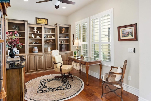 sitting room featuring ceiling fan and dark hardwood / wood-style floors