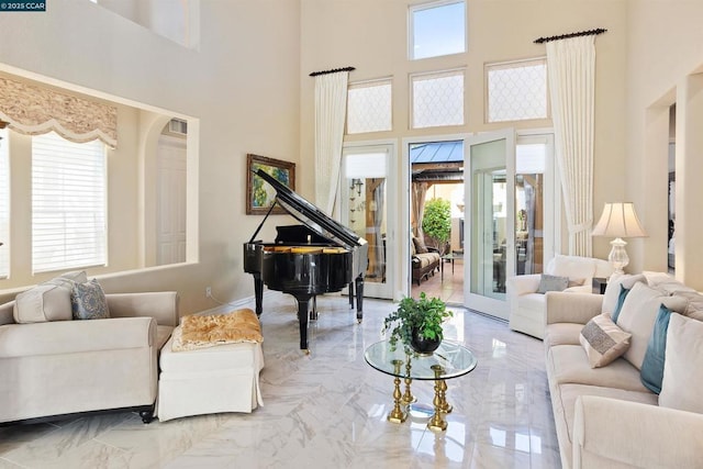 living room with a towering ceiling