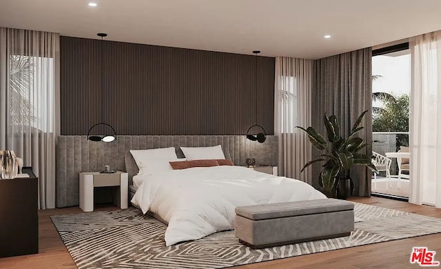 bedroom with light wood-type flooring and multiple windows