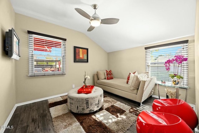 interior space with dark hardwood / wood-style floors, ceiling fan, and vaulted ceiling