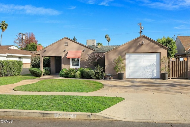 view of front of house with a front lawn and a garage