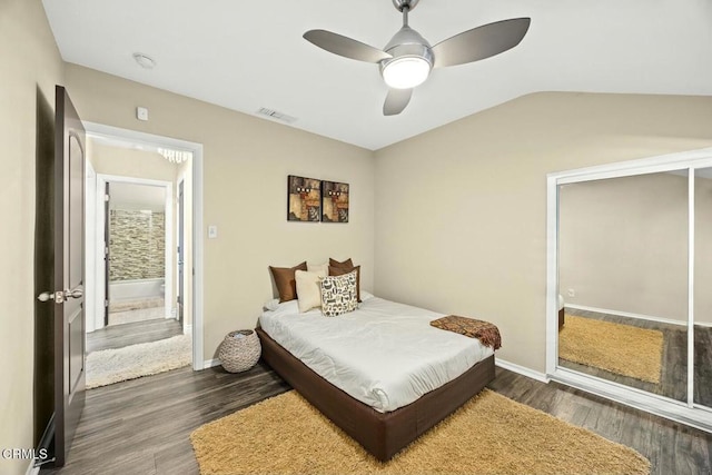 bedroom featuring ceiling fan, dark hardwood / wood-style floors, and lofted ceiling